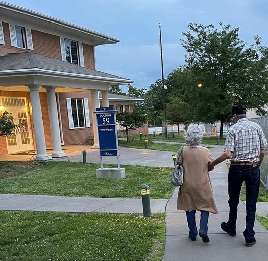 Couple walking to Fisher House Building 59 at Jefferson Barracks